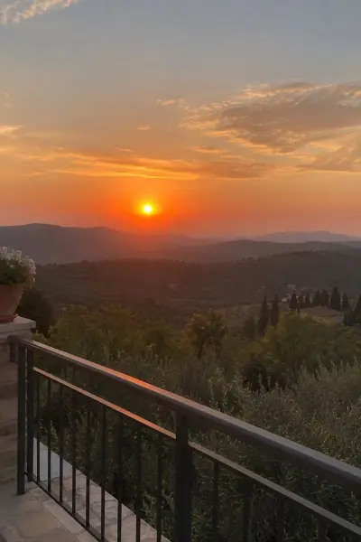 Sunset over hills from a balcony, sharp